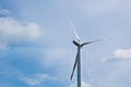 Wind power plant on the background of bright cloudy sky. wind generator close-up. green electricity, alternative energy Royalty Free Stock Photo