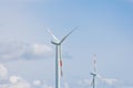 Wind power plant on the background of bright cloudy sky. wind generator close-up. green electricity, alternative energy Royalty Free Stock Photo