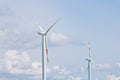 Wind power plant on the background of bright cloudy sky. wind generator close-up. green electricity, alternative energy Royalty Free Stock Photo