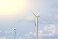 Wind power plant on the background of bright cloudy sky. wind generator close-up. green electricity, alternative energy Royalty Free Stock Photo