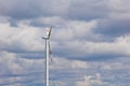 Wind power plant on the background of bright cloudy sky. wind generator close-up. green electricity, alternative energy Royalty Free Stock Photo