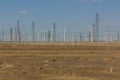 Wind power plants and electric pylons in the Gobi desert, Gansu province, Chi