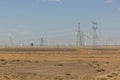 Wind power plants and electric pylons in the Gobi desert, Gansu province, Chi