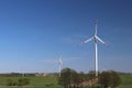 Wind power station in the daytime in the spring. Rotating blades of energy generators. Ecologically clean electricity. Modern tech Royalty Free Stock Photo