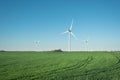 Wind power station on field. Technology and inovation. Green energy composition. Wind turbines. Royalty Free Stock Photo