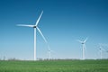 Wind power station on field. Technology and inovation. Green energy composition. Wind turbines. Royalty Free Stock Photo