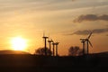 Wind power station in sunset. Romantic evening and modern technologies of ecologically clean electricity. Protection of the enviro Royalty Free Stock Photo