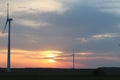 Wind power station in the sunset. Rotating blades of energy generators. Ecologically clean electricity. Modern technologies for t Royalty Free Stock Photo