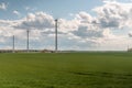 Wind power station - wind turbine against the cloudy sky. Spring Central Sweden. selective focus Royalty Free Stock Photo