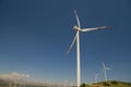 Wind power stations agaisnt blue sky background Royalty Free Stock Photo