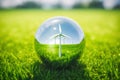 Wind Power Turbine Inside a Glass Ball on Green Field with Grass and a Blue Sky. Green Energy Concepts. Created with Generative AI