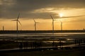 Wind power turbine at Taichung Gaomei wetlands during sunset.