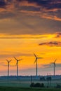 Wind power turbines and sunset sky Royalty Free Stock Photo