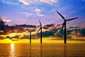 Wind power under sunset Royalty Free Stock Photo