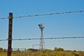 Wind Pump on farm land in Oklahoma Royalty Free Stock Photo