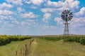 Wind pump on Freestate farm in South Africa with corn fields and Royalty Free Stock Photo