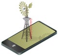 Wind pump for pumping of water on farm in mobile phone. Royalty Free Stock Photo