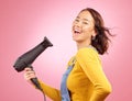 Wind, salon and hair care with woman and hairdryer in studio for hairdresser, beauty and cosmetics. Shampoo, smile and Royalty Free Stock Photo