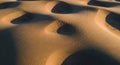 Wind-sculpted sand dunes create a mesmerizing Royalty Free Stock Photo
