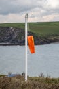A wind sock on a calm day, on the Devon coast Royalty Free Stock Photo