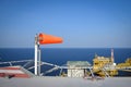 The wind sock is set on the oil rig to showing wind direction Royalty Free Stock Photo