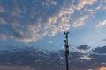 Wind speed sensor or anemometer with blue sky and orange light in evening Royalty Free Stock Photo