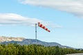 Wind strength indicator in the form of a striped cone