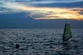 Wind surfer silhouette over sea sunset,sport activities Royalty Free Stock Photo