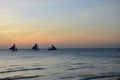 Wind surfer with sunsetting in the horizon