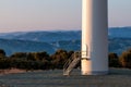 Wind tower entrance, blue mountains on background Royalty Free Stock Photo