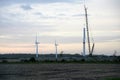 Wind tower turbine power plant at sunset Royalty Free Stock Photo