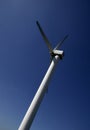 WIND TURBINE AGAINST BLUE SKY Royalty Free Stock Photo