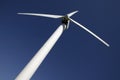 WIND TURBINE AGAINST BLUE SKY Royalty Free Stock Photo