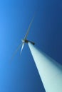 Wind turbine against clear blue sky Royalty Free Stock Photo