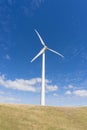 Wind turbine against clear blue sky