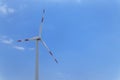 Wind turbine against clear blue sky Royalty Free Stock Photo