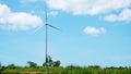 Wind turbine for alternative energy blue sky and cloud background.Alternative energy generators. Wind energy. Ecology save and Royalty Free Stock Photo