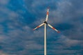 Wind turbine on the background of the blue sky. Clean renewable energy. Royalty Free Stock Photo