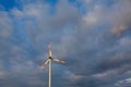 Wind turbine on the background of the blue sky. Clean renewable energy. Royalty Free Stock Photo