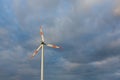 Wind turbine on the background of the blue sky. Clean renewable energy. Royalty Free Stock Photo