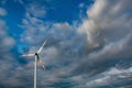 Wind turbine on the background of the blue sky. Clean renewable energy. Royalty Free Stock Photo