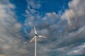 Wind turbine on the background of the blue sky. Clean renewable energy. Royalty Free Stock Photo