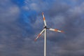 Wind turbine on the background of the blue sky. Clean renewable energy. Royalty Free Stock Photo