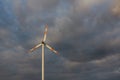 Wind turbine on the background of the blue sky. Clean renewable energy. Royalty Free Stock Photo