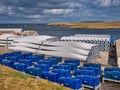 Wind turbine blades and nacelles stored for the Viking Wind Farm, under construction in Shetland, UK. Royalty Free Stock Photo