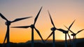 Wind turbine with blades turn on nature background with sunset sky, Wind power generators
