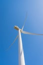 Wind turbine on blue sky background. Ecology energy saving concept Royalty Free Stock Photo