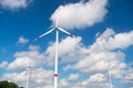 Wind turbine on cloudy blue sky. Alternative energy and electricity source. Global warming. climate change and ecology. Eco power Royalty Free Stock Photo