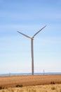 Wind turbine in a desert landscape Royalty Free Stock Photo