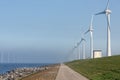 Wind turbines along Dutch dike in Flevoland near Urk